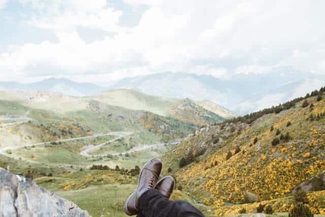Crossed legs with a view of the mountains