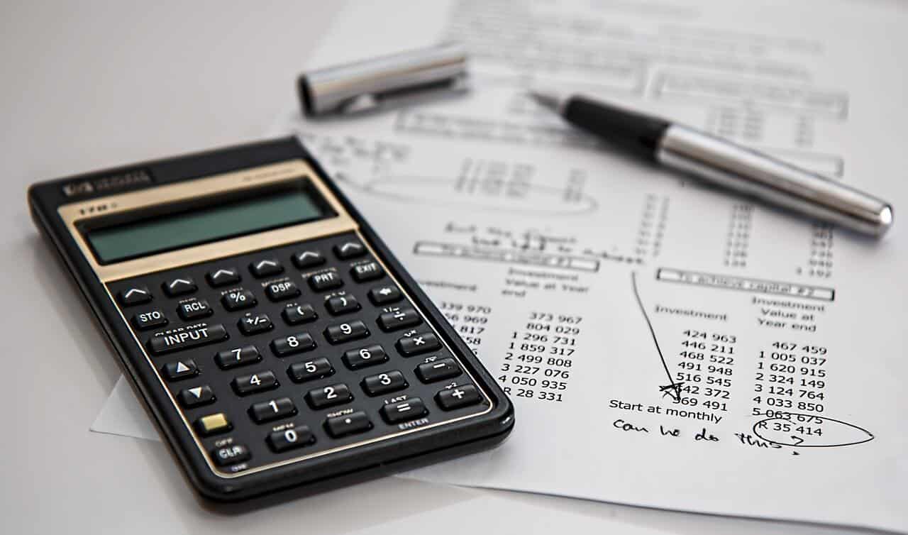 Calculator, pen and receipt, with a note at the bottom of the receipt saying "can we do this"