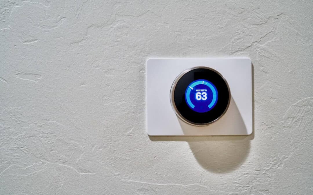 Image of a smart home thermostat on the wall.